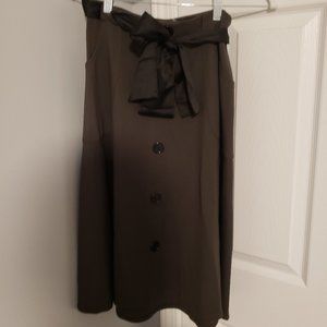 Green skirt with mock buttons and belt